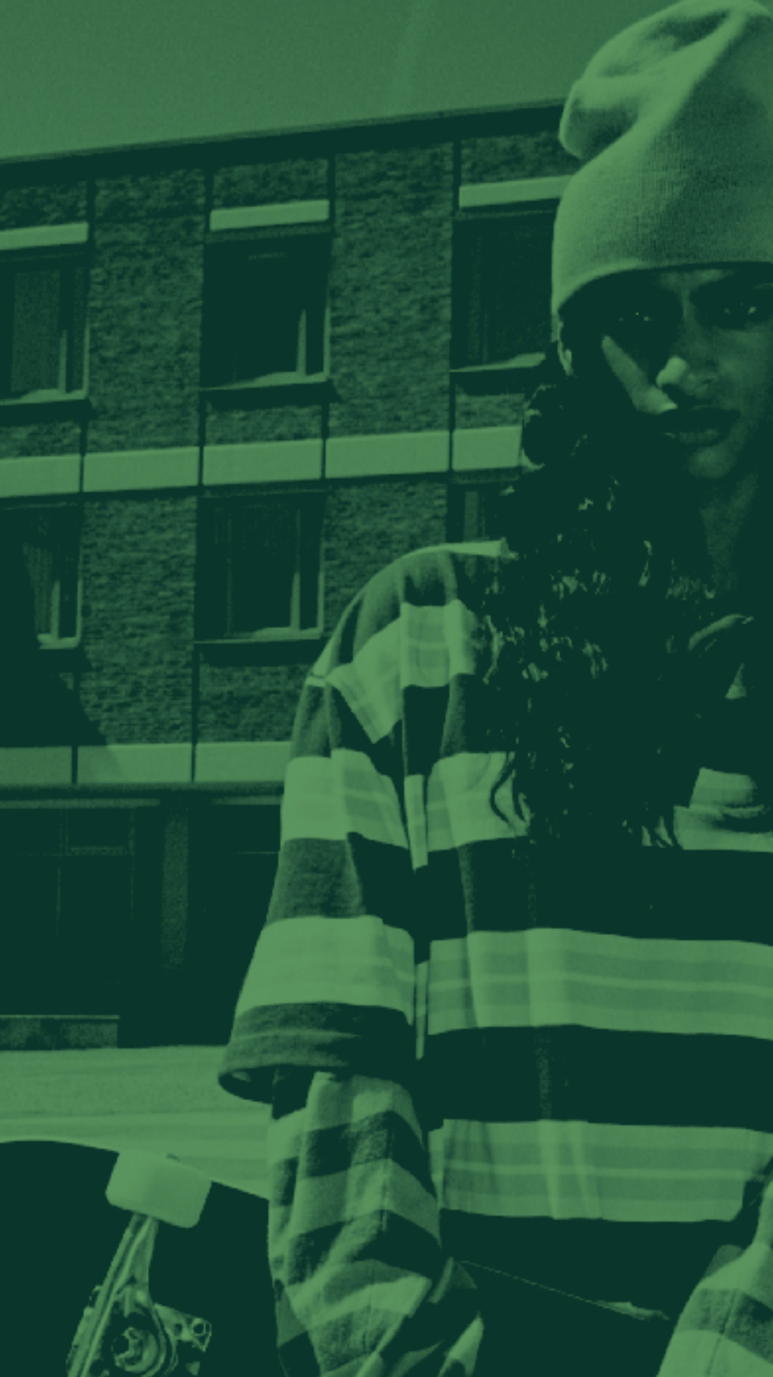 A student standing outside campus accommodation