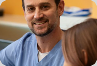 A dentist talking with a patient